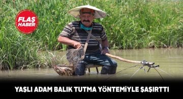 Kızılırmak’ta hem serinliyor, hem balık tutuyor