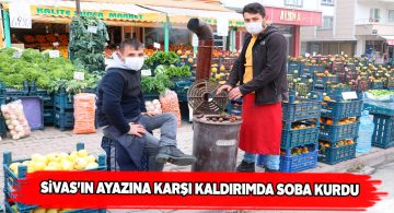 Sivas soğuğuna karşı market önüne soba kurdu