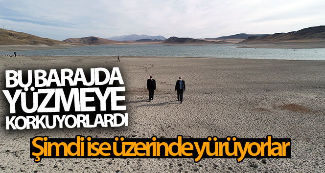 Barajın üzerinde yürüyorlar, yüzmekten korkuyorlar