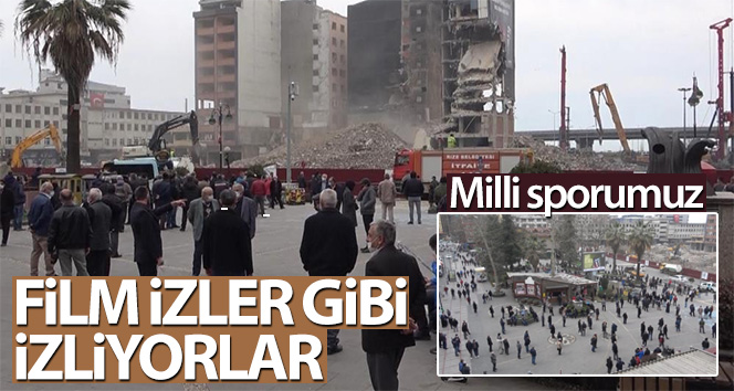 Binaların yıkılmasını film izler gibi izliyorlar