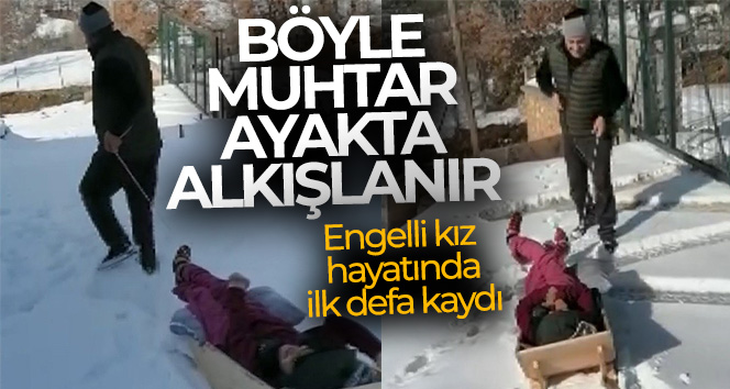 Engelli kız muhtarın yaptığı kızakla hayatında ilk defa kaydı