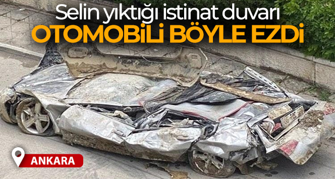 Ankara’da istinat duvarının altında kalan otomobil adeta kağıda döndü