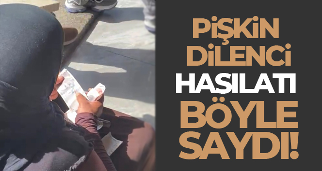 Taksim’de hasılatı sayan dilenci kadın kamerada